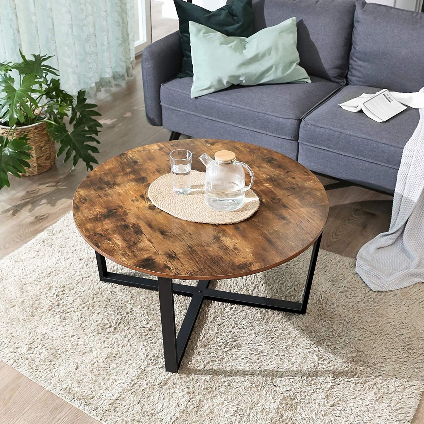 round-coffee-table-rustic-brown-and-black at www.mallsonline.com.au